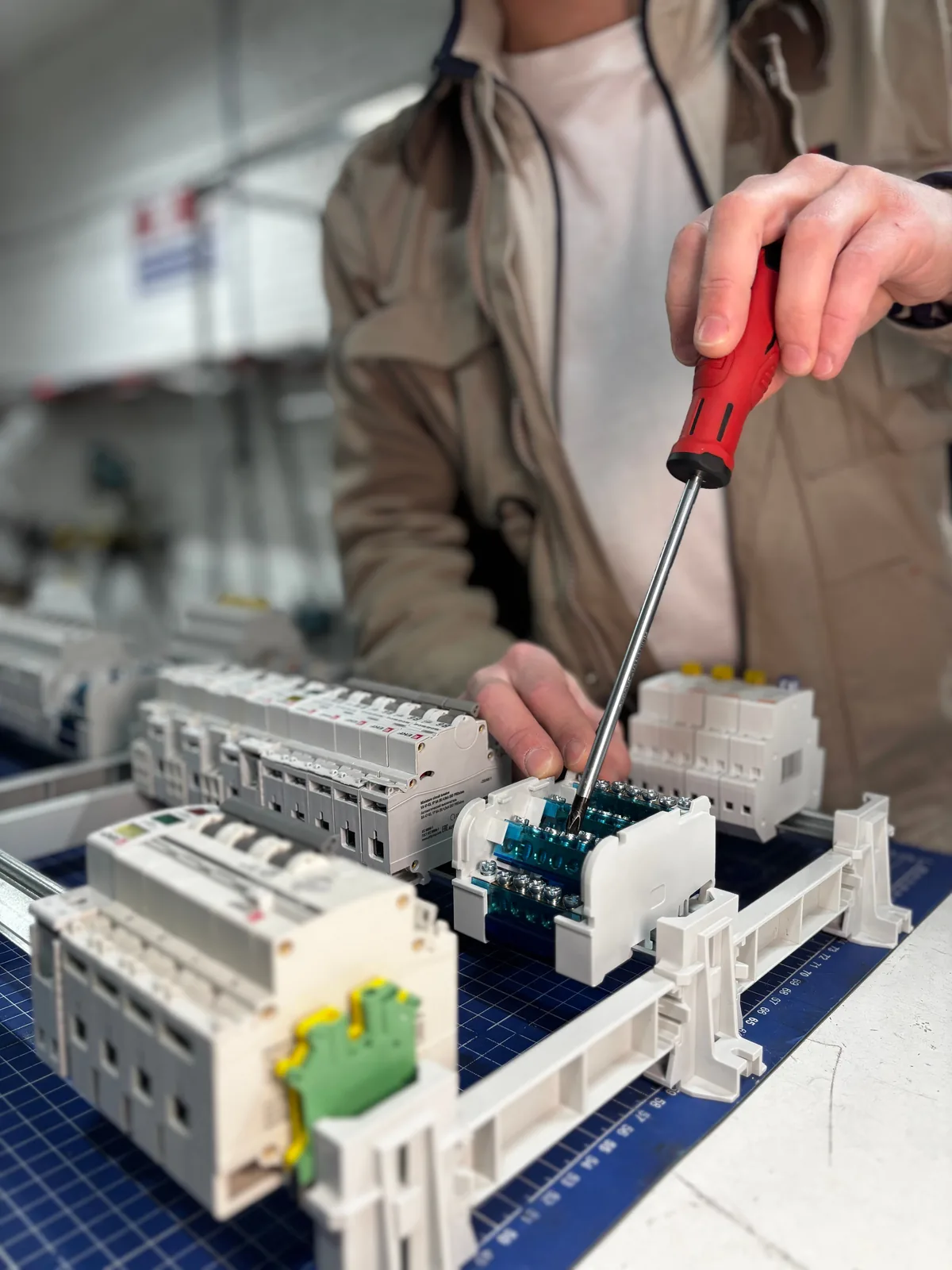 Breakers assembled on a DIN rail before installation, for ev charger installation in Hamilton