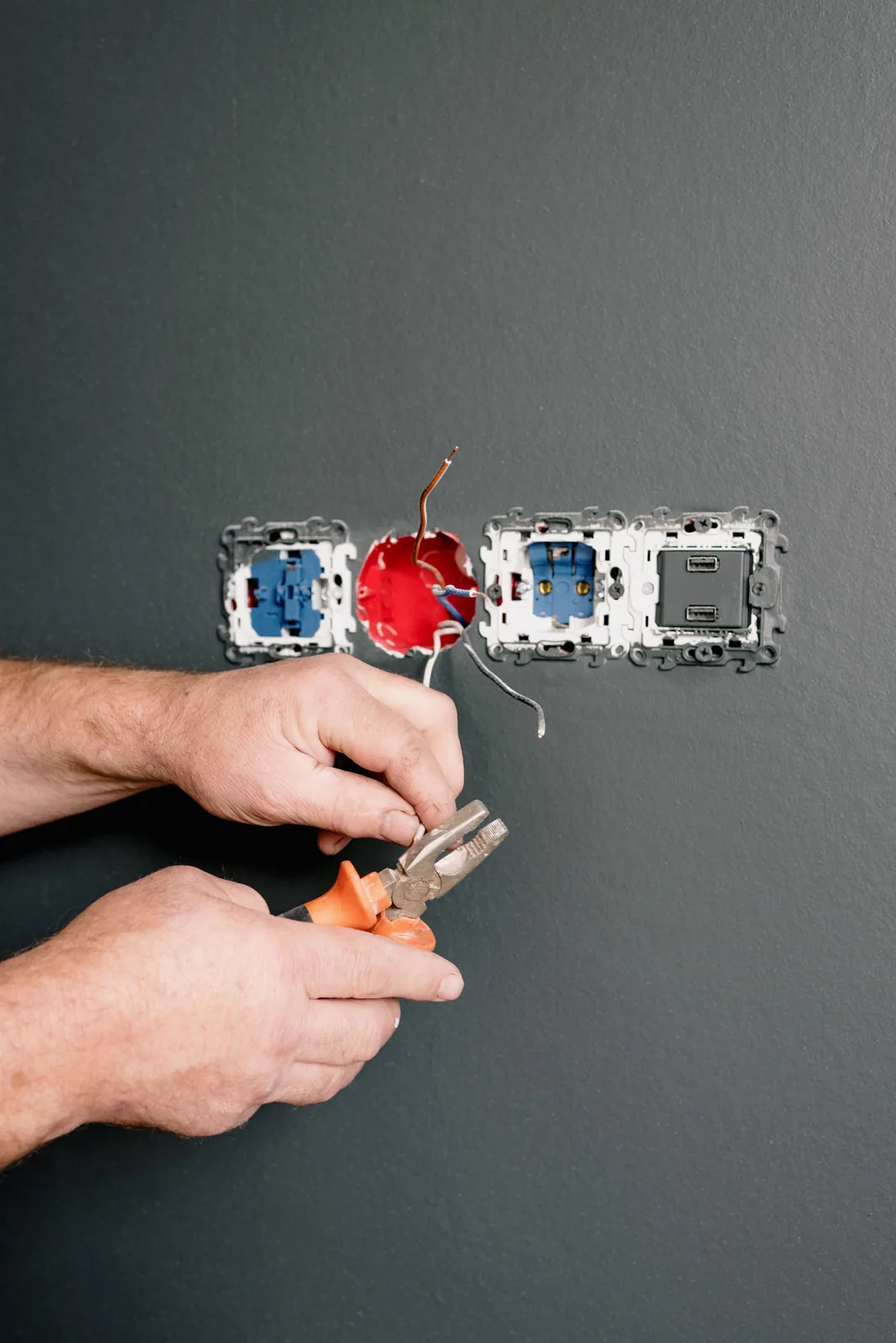 Wiring an outlet box into a finished wall, for code violation in Hamilton
