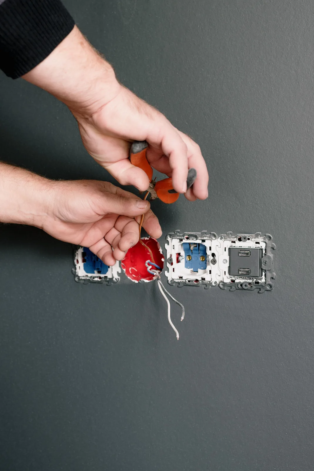 Stripping conductors at an outlet box, for outlet installation in Hamilton