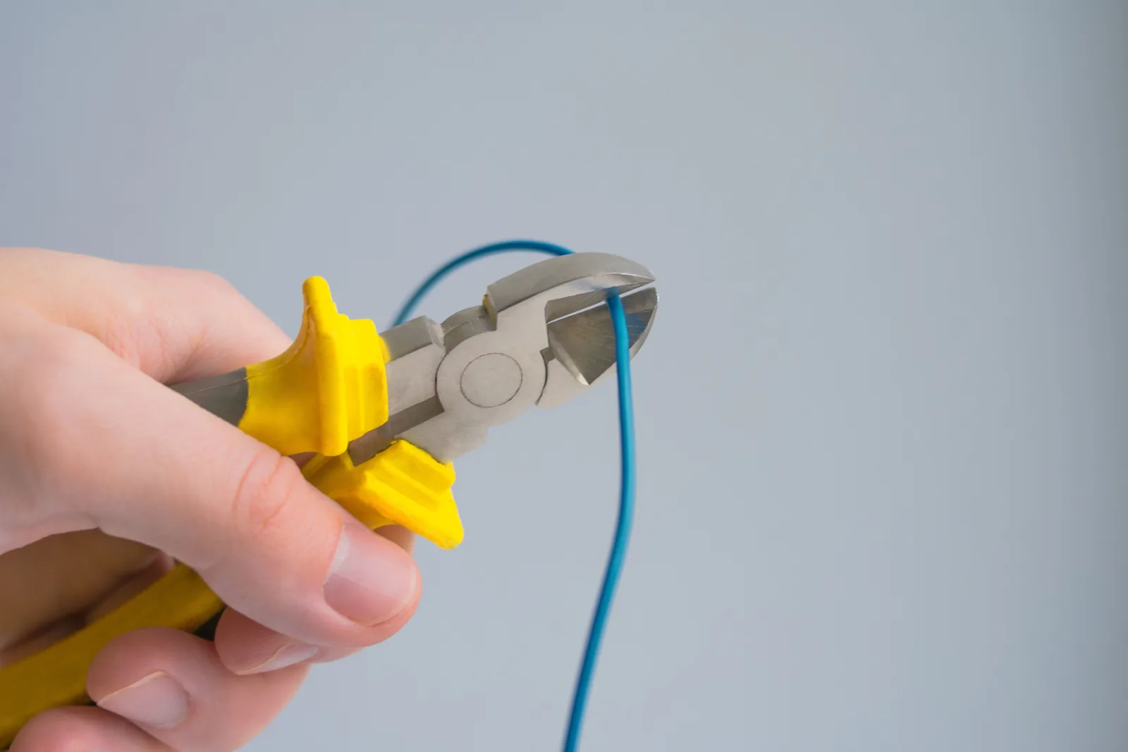 Cutting a conductor to length, for outlet installation in Hamilton